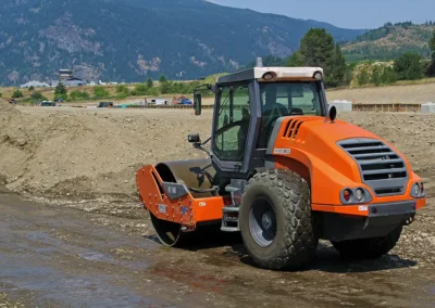 Skemxist Solutions Equipment Gravel Packer Doing a Lift in Roadbuilding Project