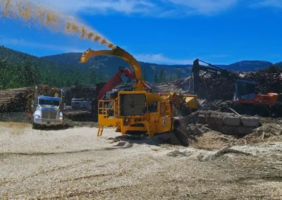 Skemxist Solutions Equipment Mobile Whole Log Chipper Running at Chipping Site