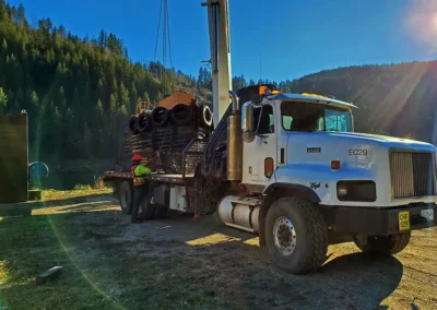 Skemxist Solutions Equipment Tug Boat Getting Loaded on Flat Deck Truck