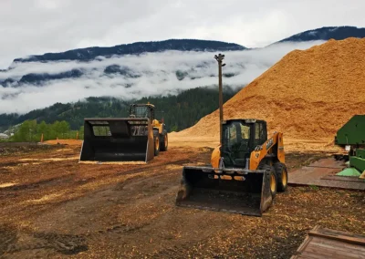 Skemxist Solutions Equipment Wheel Loader with Chip Bucket and Skid Steer Loader at Chip Pile Site